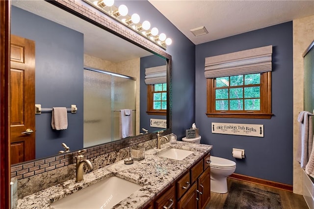 510 Fair Vista Ct, Pine Twp Nal, PA 15090 - full bathroom with a shower stall, double vanity, toilet, and baseboards