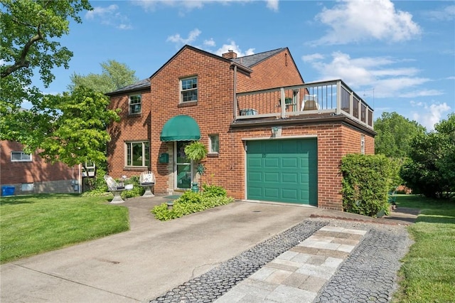 4335 Frank St, Whitehall, PA 15227 - view of front facade with a balcony, concrete driveway, a front lawn, and brick siding