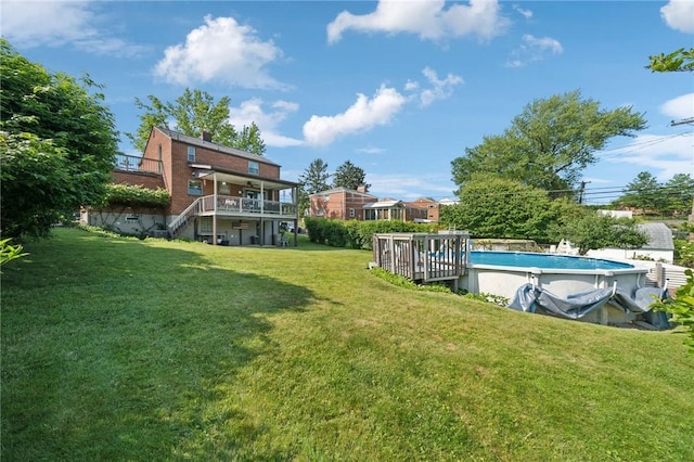 4335 Frank St, Whitehall, PA 15227 - view of grassy yard featuring a deck and an outdoor pool