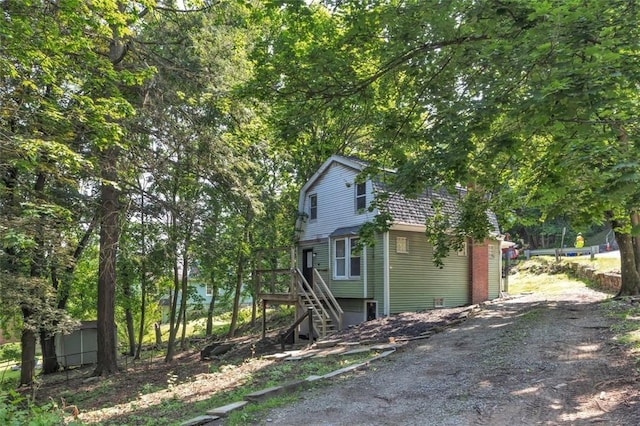 8536 Pershing St, Penn Hills, PA 15235 - view of property exterior featuring a gambrel roof and stairway
