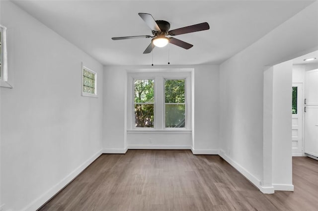 8536 Pershing St, Penn Hills, PA 15235 - spare room featuring wood finished floors, ceiling fan, and baseboards