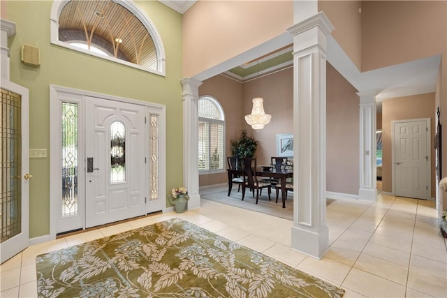 221 Red Oak Dr, Peters Twp, PA 15317 - tiled foyer entrance featuring decorative columns, a towering ceiling, and baseboards