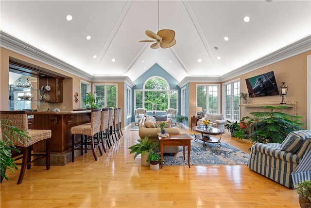 221 Red Oak Dr, Peters Twp, PA 15317 - living area featuring wood finished floors, crown molding, a ceiling fan, a fireplace, and bar