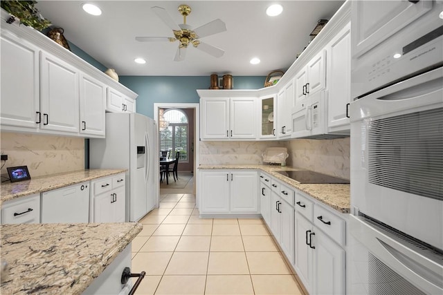 221 Red Oak Dr, Peters Twp, PA 15317 - kitchen featuring white appliances, white cabinetry, light tile patterned floors, ceiling fan, and decorative backsplash