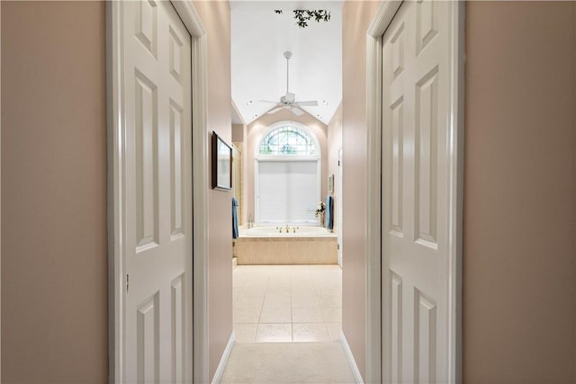 221 Red Oak Dr, Peters Twp, PA 15317 - hallway featuring light tile patterned flooring, lofted ceiling, and baseboards