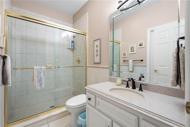 221 Red Oak Dr, Peters Twp, PA 15317 - bathroom featuring toilet, vanity, a shower stall, tile patterned flooring, and a wainscoted wall