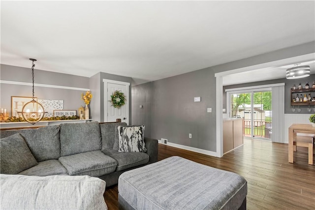 25 Rolling Rd, Cranberry Twp, PA 16066 - living area with a chandelier, dark wood-type flooring, and baseboards