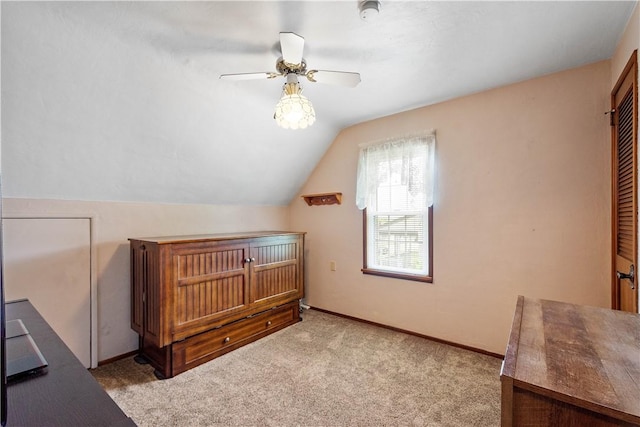 711 Ascension Dr W, West Mifflin, PA 15122 - additional living space with vaulted ceiling, carpet floors, a ceiling fan, and baseboards
