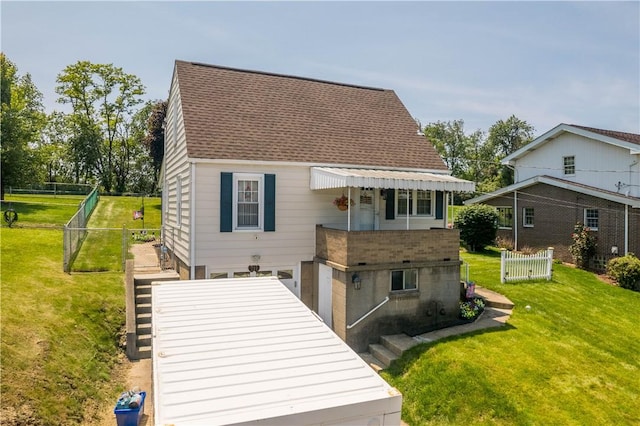 711 Ascension Dr W, West Mifflin, PA 15122 - rear view of property featuring an attached garage and a shingled roof