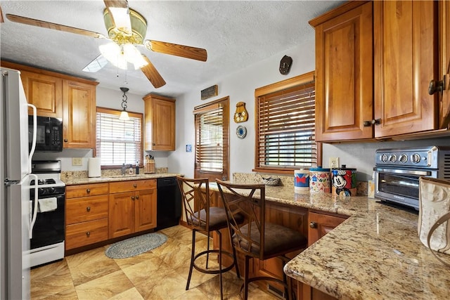 711 Ascension Dr W, West Mifflin, PA 15122 - kitchen featuring black appliances, a ceiling fan, a sink, brown cabinets, and a textured ceiling