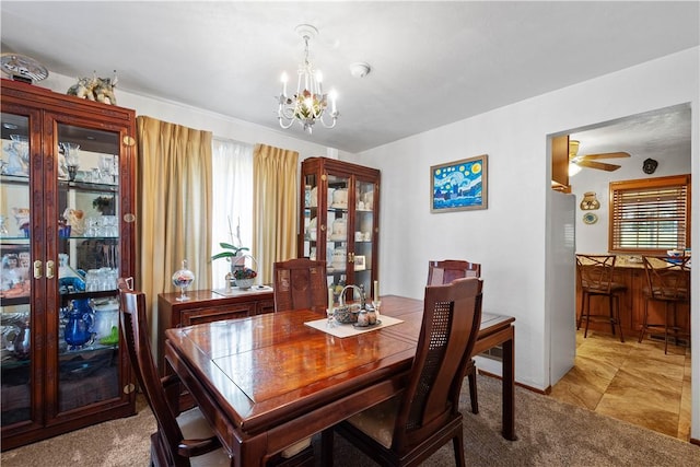 711 Ascension Dr W, West Mifflin, PA 15122 - dining room with a chandelier, a ceiling fan, and bar area