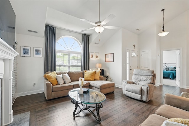 342 Saddlebrook Rd, West Deer, PA 15044 - living area featuring dark wood-type flooring, a ceiling fan, baseboards, a fireplace, and high vaulted ceiling