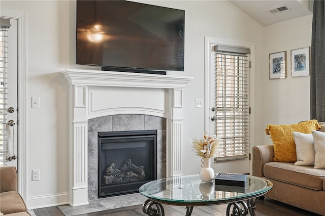 342 Saddlebrook Rd, West Deer, PA 15044 - living area with dark wood-type flooring, a tile fireplace, vaulted ceiling, and baseboards