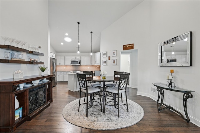 342 Saddlebrook Rd, West Deer, PA 15044 - dining room with high vaulted ceiling, dark wood finished floors, baseboards, and recessed lighting