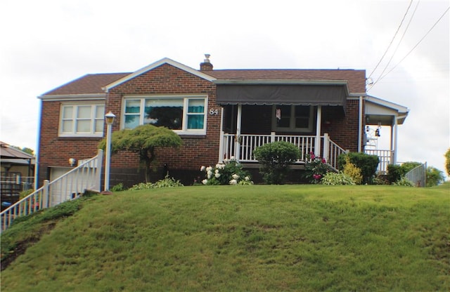 84 Pennsylvania Ave, Monessen, PA 15062 - view of front of property with a front yard, brick siding, a porch, and a chimney