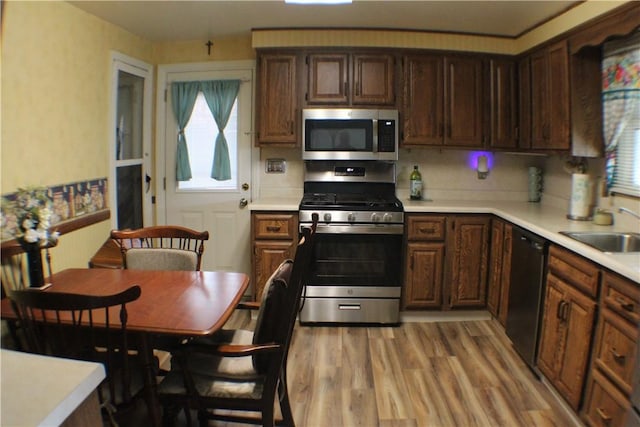 84 Pennsylvania Ave, Monessen, PA 15062 - kitchen featuring stainless steel appliances, light countertops, a sink, and plenty of natural light