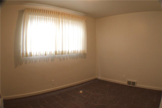 84 Pennsylvania Ave, Monessen, PA 15062 - unfurnished room featuring dark colored carpet and baseboards