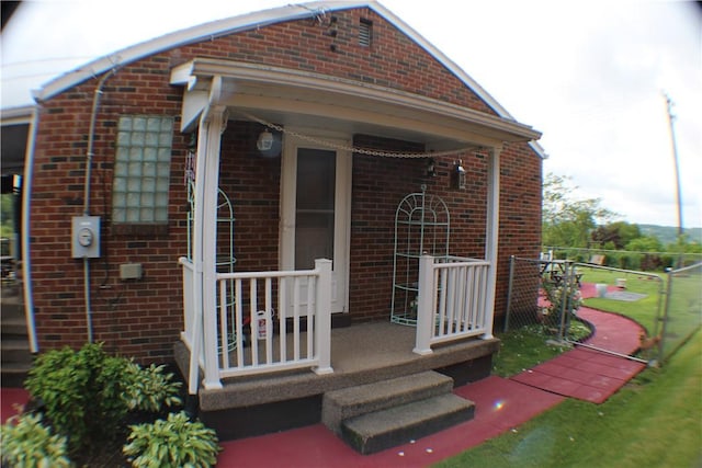 84 Pennsylvania Ave, Monessen, PA 15062 - property entrance with brick siding and a porch