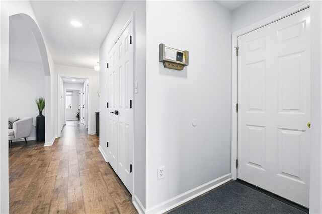 123 Ashley Hill Dr, Mccandless, PA 15090 - hallway featuring arched walkways, dark wood-style flooring, baseboards, and recessed lighting