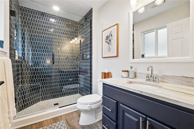 123 Ashley Hill Dr, Mccandless, PA 15090 - bathroom with vanity, toilet, a shower stall, and wood finished floors