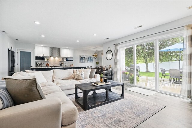 123 Ashley Hill Dr, Mccandless, PA 15090 - living room featuring light wood-style flooring and recessed lighting