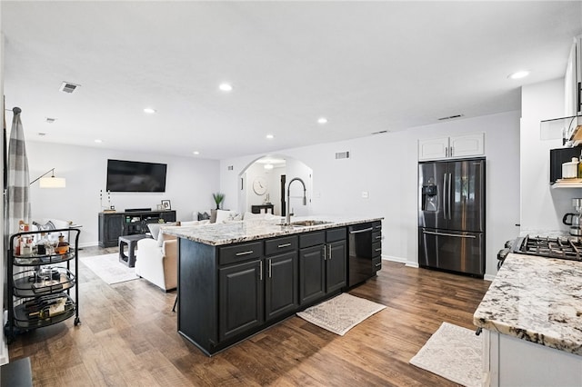 123 Ashley Hill Dr, Mccandless, PA 15090 - kitchen with fridge with ice dispenser, arched walkways, a sink, dishwasher, and a center island with sink