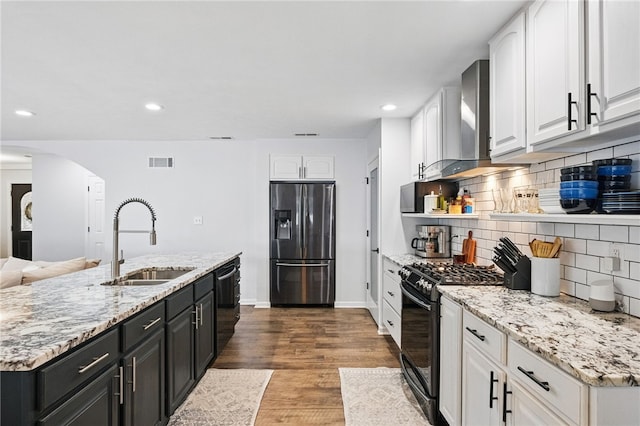 123 Ashley Hill Dr, Mccandless, PA 15090 - kitchen with black appliances, a sink, white cabinets, arched walkways, and recessed lighting