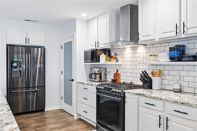 123 Ashley Hill Dr, Mccandless, PA 15090 - kitchen with stainless steel appliances, wall chimney exhaust hood, dark wood-style flooring, white cabinets, and recessed lighting