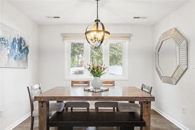 123 Ashley Hill Dr, Mccandless, PA 15090 - dining area with a chandelier, dark wood-style floors, and baseboards