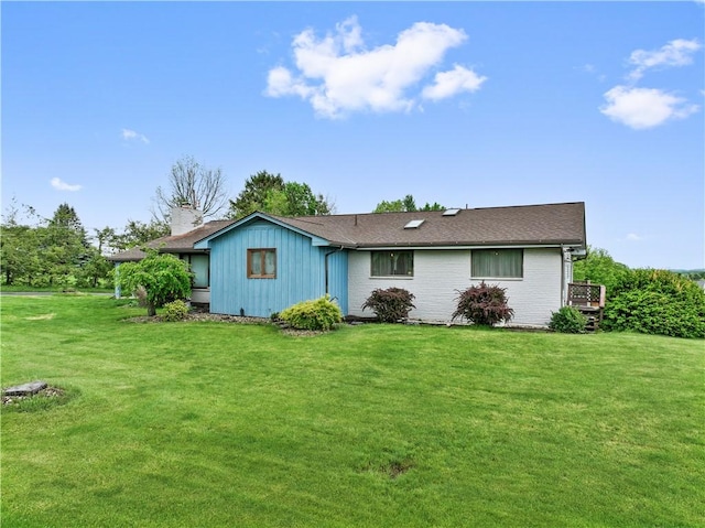 829 Hecla Rd, Mount Pleasant Twp Wml, PA 15666 - back of property featuring a lawn and brick siding
