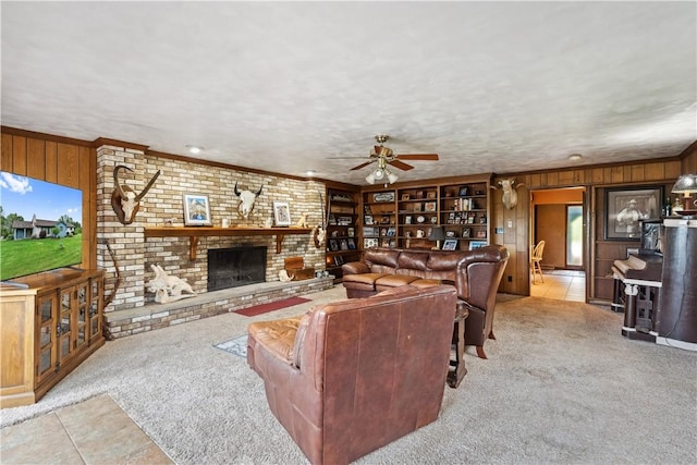 829 Hecla Rd, Mount Pleasant Twp Wml, PA 15666 - carpeted living room featuring wood walls, a ceiling fan, healthy amount of natural light, tile patterned flooring, and a brick fireplace