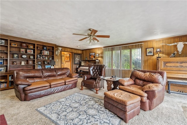 829 Hecla Rd, Mount Pleasant Twp Wml, PA 15666 - carpeted living area featuring wooden walls and ceiling fan