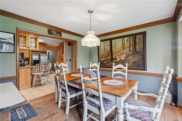 829 Hecla Rd, Mount Pleasant Twp Wml, PA 15666 - dining room with ornamental molding, a chandelier, and light wood-type flooring