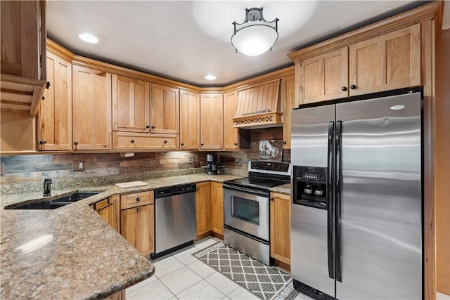 829 Hecla Rd, Mount Pleasant Twp Wml, PA 15666 - kitchen featuring stainless steel appliances, a sink, light tile patterned floors, light stone counters, and tasteful backsplash