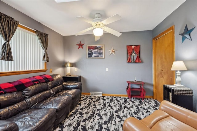 829 Hecla Rd, Mount Pleasant Twp Wml, PA 15666 - living room featuring a ceiling fan, baseboards, and wood finished floors