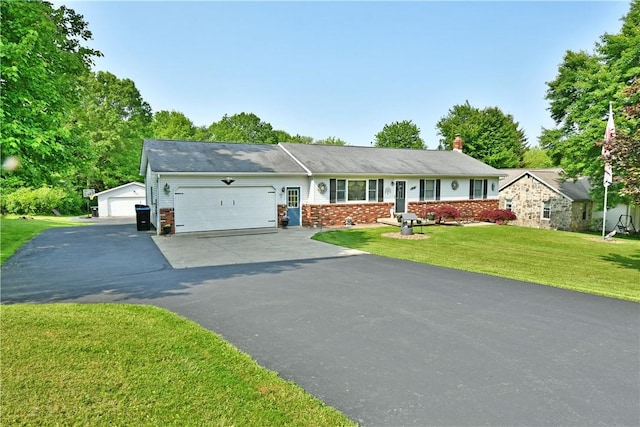 3062 Longview Rd, Hermitage, PA 16148 - single story home with driveway, an attached garage, brick siding, a front yard, and a chimney