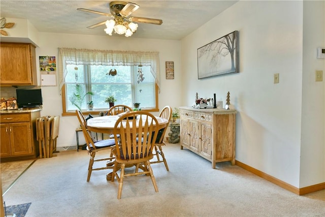 3062 Longview Rd, Hermitage, PA 16148 - dining space featuring a ceiling fan, light colored carpet, and baseboards