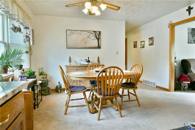 3062 Longview Rd, Hermitage, PA 16148 - dining space with ceiling fan, light colored carpet, and baseboards