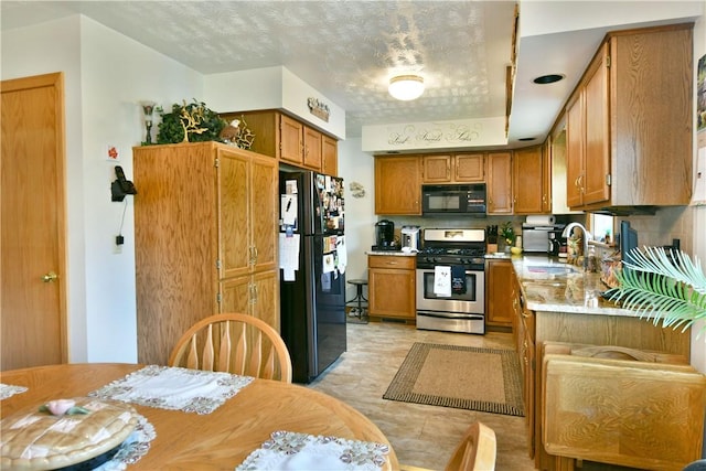 3062 Longview Rd, Hermitage, PA 16148 - kitchen featuring black appliances, a sink, light countertops, and brown cabinets