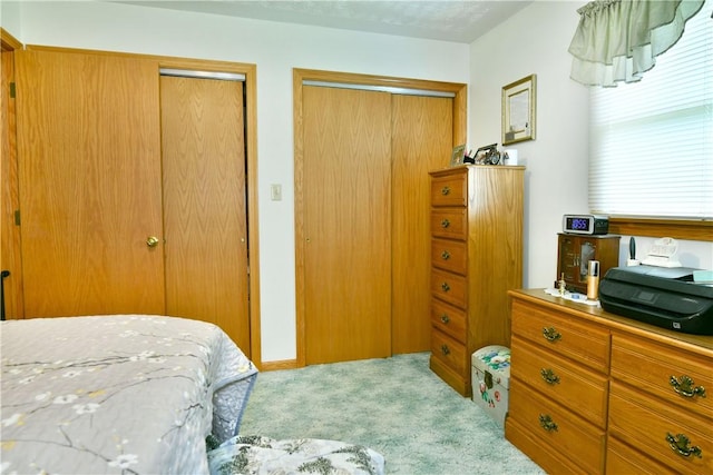 3062 Longview Rd, Hermitage, PA 16148 - carpeted bedroom featuring two closets