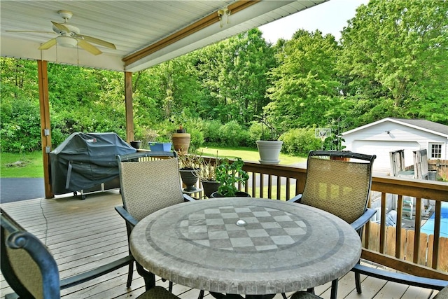 3062 Longview Rd, Hermitage, PA 16148 - wooden deck featuring outdoor dining area, a ceiling fan, an outdoor structure, and a grill