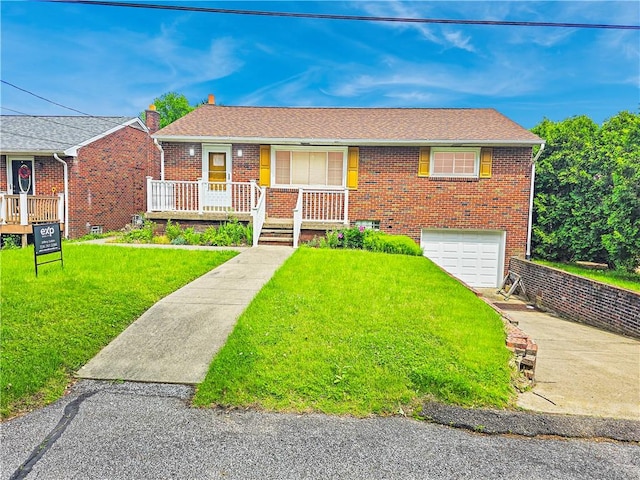 2828 School St, Harmony Twp Bea, PA 15003 - view of front of home featuring driveway, a garage, brick siding, a front lawn, and covered porch