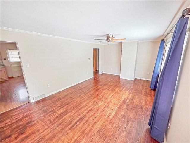 2828 School St, Harmony Twp Bea, PA 15003 - spare room with ceiling fan, ornamental molding, light wood-style flooring, and baseboards