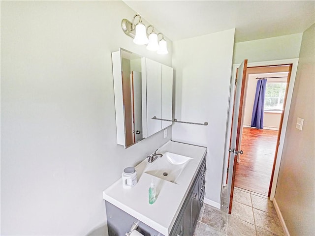 2828 School St, Harmony Twp Bea, PA 15003 - bathroom featuring baseboards and vanity