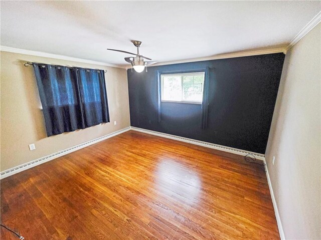 2828 School St, Harmony Twp Bea, PA 15003 - spare room featuring crown molding, wood finished floors, baseboards, and ceiling fan