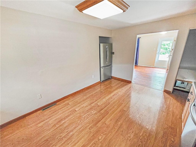 2828 School St, Harmony Twp Bea, PA 15003 - empty room with light wood-style floors and baseboards