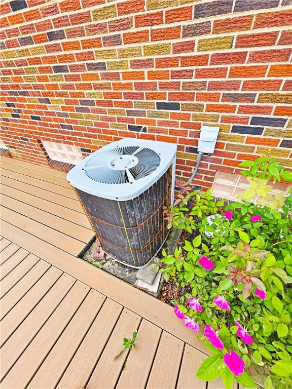 2828 School St, Harmony Twp Bea, PA 15003 - exterior view of central AC unit and brick siding
