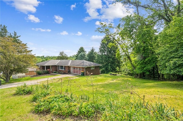 308 Cypress St, Rostraver, PA 15089 - view of front of house with driveway, a front lawn, and brick siding