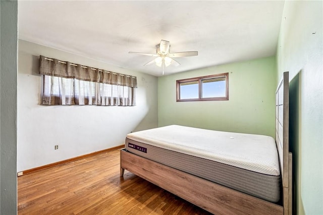 308 Cypress St, Rostraver, PA 15089 - bedroom with wood finished floors, baseboards, and ceiling fan