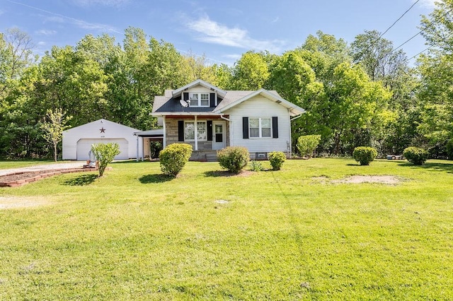 508 Meadow St, North Union Twp, PA 15401 - bungalow-style home with an outdoor structure, a front yard, a garage, covered porch, and view of wooded area